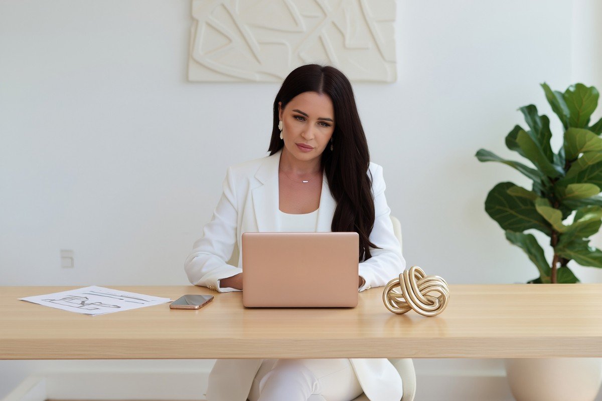Woman planning early retirement at desk.
